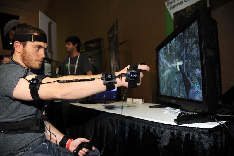 Chris George plays a video game wearing the PrioVR full body harness. With 17 body and head sensors each containing a magnetometer, gyroscope and accelerometer, it translates body motion into action by gaming characters. Robyn Beck / AFP Photo