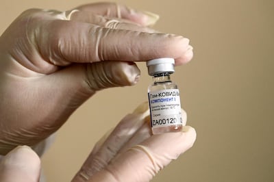 (FILES) In this file photo taken on December 05, 2020 a nurse shows the Sputnik V (Gam-COVID-Vac) vaccine against the coronavirus disease (COVID-19) at a clinic in Moscow, amid the ongoing coronavirus disease pandemic. Pharmaceutical giant AstraZeneca's Russian branch said on December 11, 2020 it would use part of Russia's homemade Sputnik V vaccine in further clinical trials. / AFP / Kirill KUDRYAVTSEV

