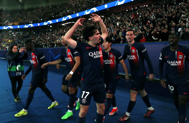 Vitinha and PSG teammates celebrate in front of the fans after taking a 2-1 lead against Barcelona. Getty Images