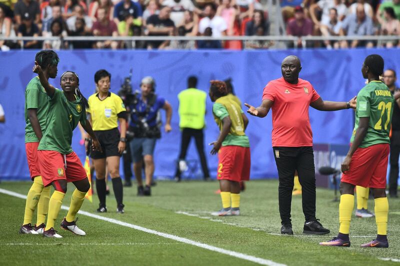 Cameroon's forward Ajara Nchout (2ndL) and Cameroon's coach Alain Djeumfa (2ndR) react after her goal was disallowed for offside during the France 2019 Women's World Cup round of sixteen football match between England and Cameroon, on June 23, 2019, at the Hainaut stadium in Valenciennes, northern France. (Photo by Philippe HUGUEN / AFP)