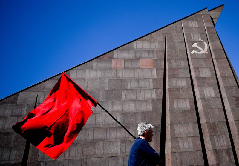 A red flag is carried at the Soviet Second World War memorial in Treptow Park, Berlin. The unconditional surrender of Nazi Germany on all fronts took place on May 9, 1945. EPA