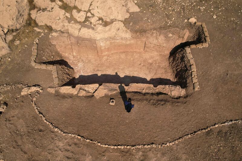 An aerial picture shows a view of a dig revealing an ancient irrigation canal lined with rock carvings dating back to Assyrian times, in the archaeological site of Faydeh (Faida) in the mountains near the town of the same name in the autonomous Kurdish region of Iraq, on October 16, 2022, during the opening of the first phase of a planned archaeological park in Iraqi Kurdistan.  (Photo by Ismael ADNAN  /  AFP)