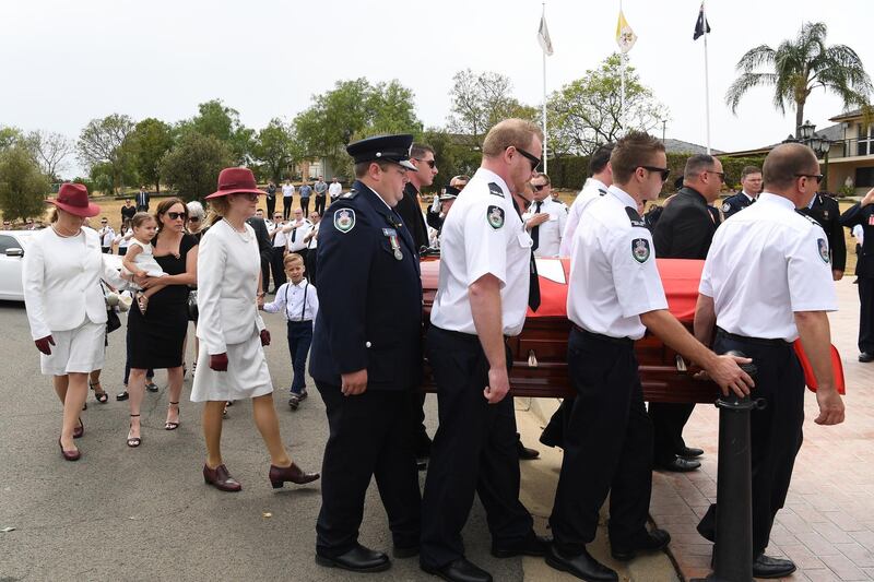 Colleagues carry the casket during the funeral for NSW RFS volunteer Andrew O'Dwyer at Our Lady of Victories Catholic Church in Horsley Park, Sydney.  EPA