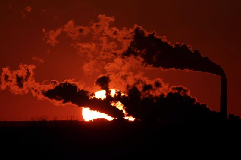 Emissions from the Jeffrey Energy Center coal-fired power plant are silhouetted against the setting sun in Kansas, US. Irena also highlighted 'innovative solutions' that are reshaping the global energy system allowing for rapid decarbonisation. AP Photo