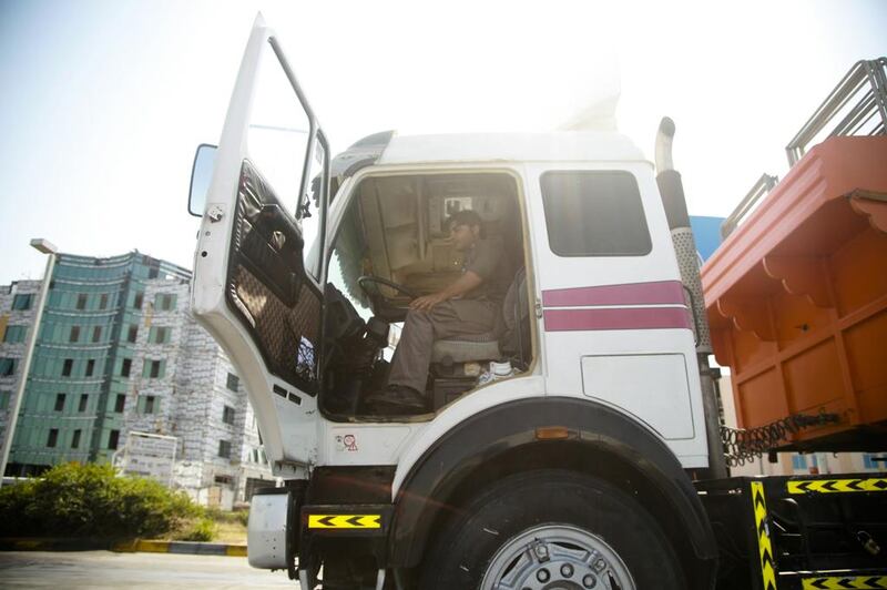 Experts say drivers working in the logistics and transport sector continue to face long hours and poor working conditions that can affect their concentration. Lee Hoagland / The National