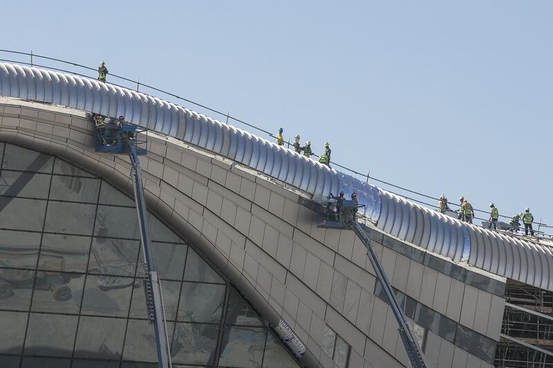 Construction crew continue work at Midfield Terminal in December last year. Mona Al Marzooqi / The National