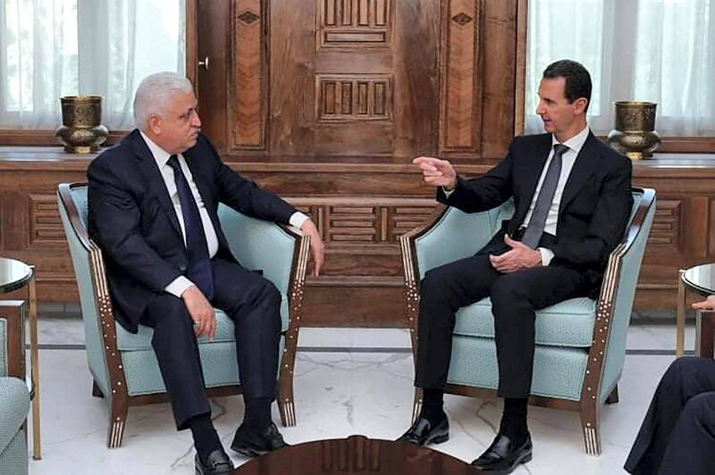 This handout picture released by the Syrian Presidency Facebook page on October 17, 2019, shows President Bashar al-Assad (R) meeting with Iraqi National Security Adviser Faleh al-Fayyad in Damascus. (Photo by - / Syrian Presidency Facebook page / AFP) / RESTRICTED TO EDITORIAL USE - MANDATORY CREDIT "AFP PHOTO / Syrian Presidency Facebook page " - NO MARKETING NO ADVERTISING CAMPAIGNS - DISTRIBUTED AS A SERVICE TO CLIENTS