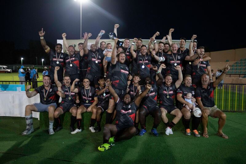Dubai Exiles celebrate winning the UAE Premiership final against Dubai Tigers.