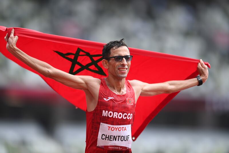 El Amin Chentouf celebrates after winning the gold medal in the marathon T12 at the Tokyo 2020 Paralympic Games. Getty Images