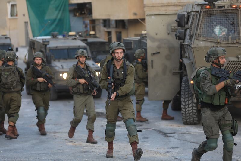 Israeli soldiers carry out a raid in August in Rummana village, near the West Bank city of Jenin. EPA