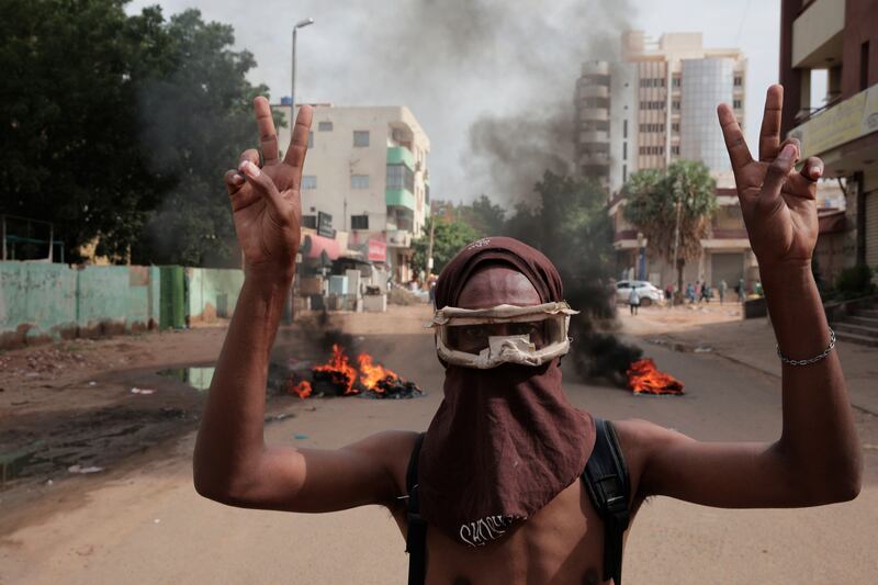 A man protests in Khartoum against the Sudanese military on Tuesday. At least 117 protesters have been killed since last October by the security forces during street rallies. AP