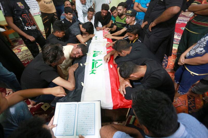 Mourners attend the funeral of the security men who were kidnapped and killed by Islamic State militants, in Kerbala, Iraq June 28, 2018. REUTERS/Alaa al-Marjani