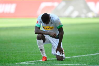 Moenchengladbach's French forward Marcus Thuram reacts after scoring during the German first division Bundesliga football match Borussia Moenchengladbach v Union Berlin in Moenchengladbach, western Germany, on 31 May, 2020. RESTRICTIONS: DFL REGULATIONS PROHIBIT ANY USE OF PHOTOGRAPHS AS IMAGE SEQUENCES AND/OR QUASI-VIDEO / AFP / POOL / Martin Meissner / RESTRICTIONS: DFL REGULATIONS PROHIBIT ANY USE OF PHOTOGRAPHS AS IMAGE SEQUENCES AND/OR QUASI-VIDEO