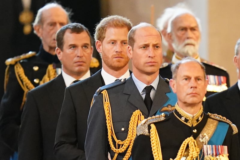 Prince Harry, Prince William, and Prince Edward follow the bearer party carrying the coffin of Queen Elizabeth into Westminster Hall. PA