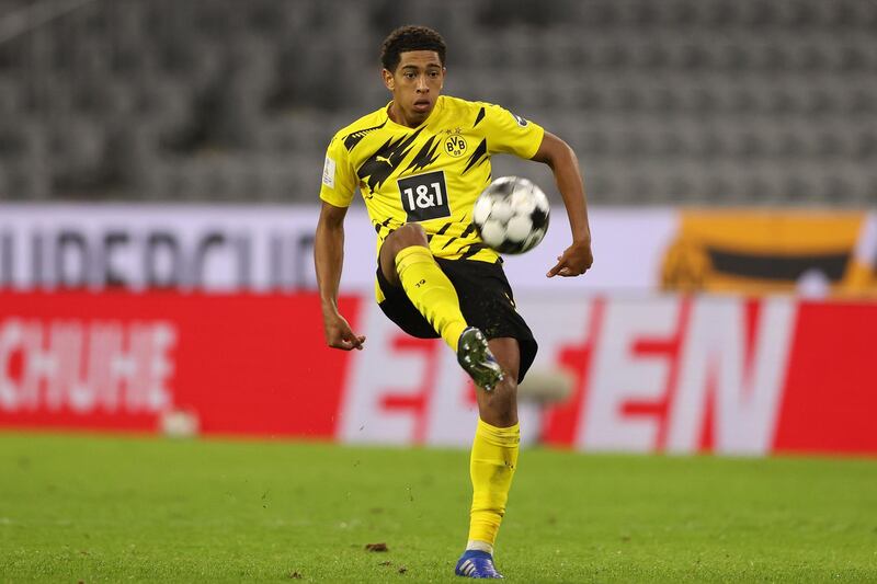 MUNICH, GERMANY - SEPTEMBER 30: Jude Bellingham of Dortmund runs with the ball during the Supercup 2020 match between FC Bayern MÃ¼nchen and Borussia Dortmund at Allianz Arena on September 30, 2020 in Munich, Germany. (Photo by Alexander Hassenstein/Getty Images )