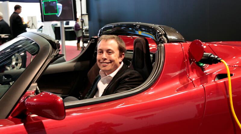 Mr Musk in the Tesla Roadster electric car at the North American International Auto Show in Detroit, in 2009  Reuters
