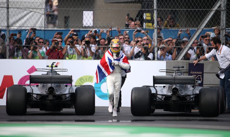 Mercedes' Lewis Hamilton celebrates after winning the World Championship. Edgard Garrido / Reuters