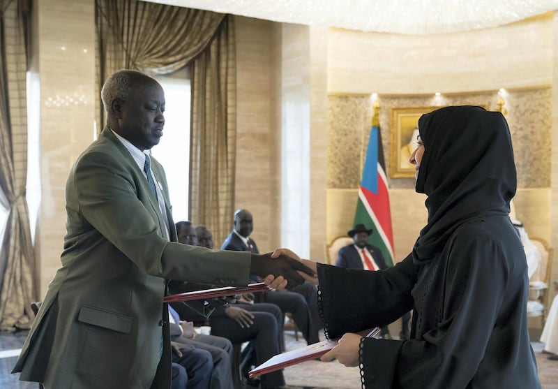 ABU DHABI, UNITED ARAB EMIRATES - April 23, 2019: HE Reem Ibrahim Al Hashimi, UAE Minister of State for International Cooperation (R), exchanges an MOU with a South Sudanese counterpart during an MOU signing ceremony at Al Shati Palace.  

( Mohamed Al Hammadi / Ministry of Presidential Affairs )
---