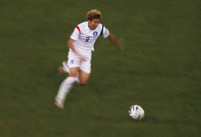South Korea's Son Heung-min runs with the ball during his team's match against Russia on Tuesday at the 2014 World Cup. David Gray / Reuters