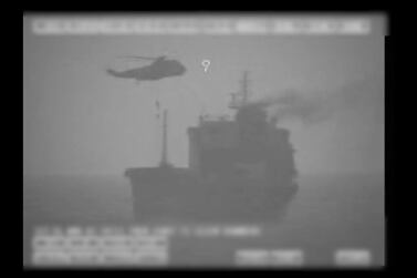 In this image made from video released by the U.S. military's Central Command, Iranian commandos fast-rope down from a helicopter onto the MV Wila oil tanker in the Gulf of Oman off the coast of the United Arab Emirates on Wednesday, Aug. 12, 2020. The Iranian navy boarded and briefly seized the Liberian-flagged oil tanker near the strategic Strait of Hormuz amid heightened tensions between Tehran and the U.S., a U.S. military official said Thursday, Aug. 13, 2020. (U.S. military's Central Command via AP)