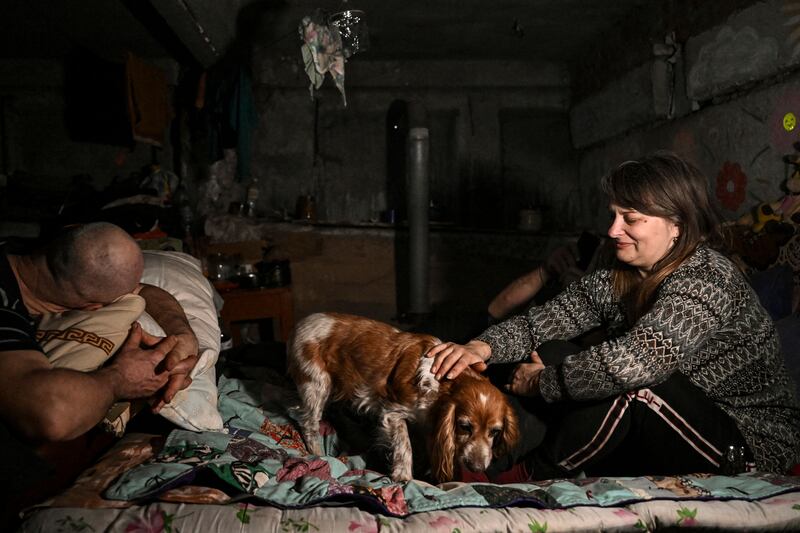 Residents take shelter in a basement in Chasiv Yar, near Bakhmut, scene of heavy fighting in the Russia-Ukraine war. AFP