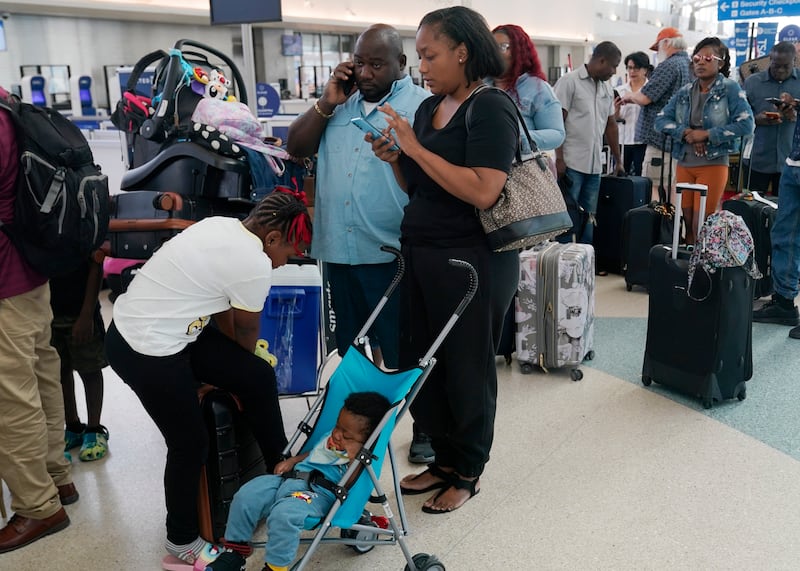 Travellers stranded at the Fort Lauderdale airport wait for flights to resume. AP