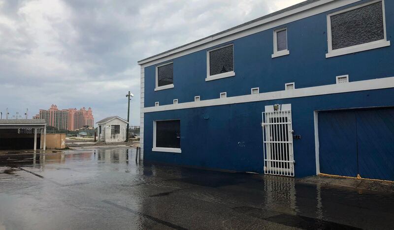 View of a flooded street with Atlantis resort in the background in Downtown, Nassau .  AFP