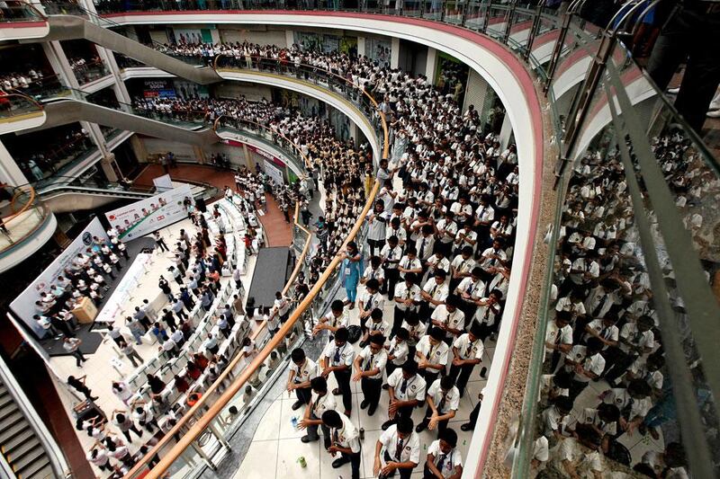 School kids take part in the clean hands to save life campaign held at the Centre One Mall in Vashi in Navi Mumbai. The Fortis Foundation created a new Guinness World Records for the largest number of people hand sanitizing at a single venue.  Pawan Singh / The National