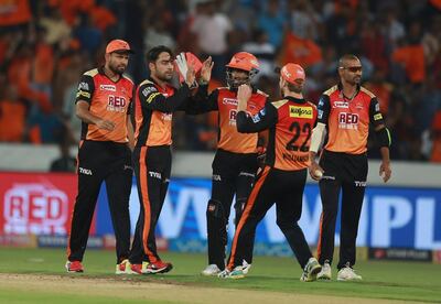 Sunrisers Hyderabad bowler Rashid Khan, 2nd from left celebrates the wicket of Karun Nair with their captain Kane Williamson during VIVO IPL cricket T20 match against Kings XI Punjab in Hyderabad, India, Thursday, April 26, 2018. (AP Photo/Mahesh Kumar A.)