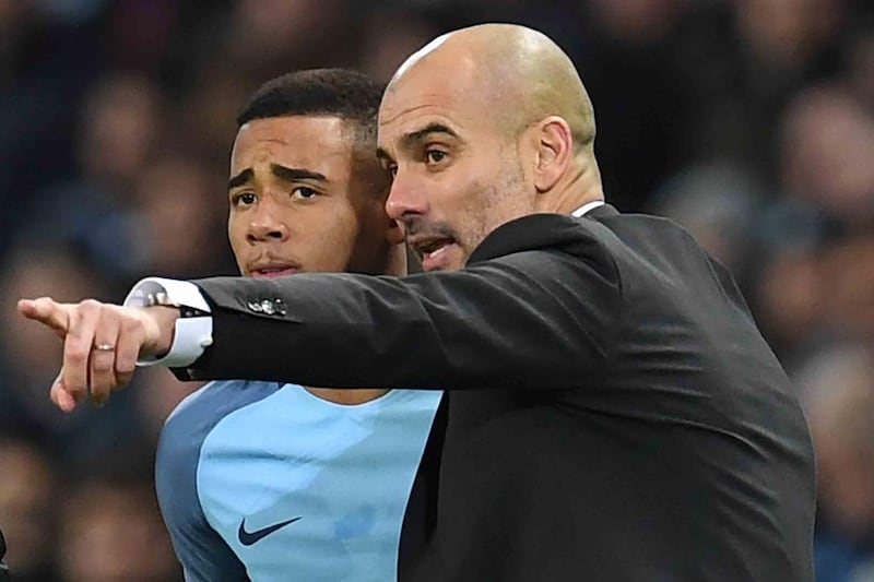 Gabriel Jesus, left, is one of the key players Pep Guardiola, right, has signed for Manchester City. Paul Ellis / AFP