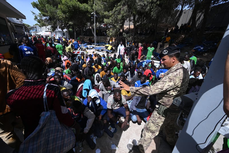 Migrants at a processing centre on the Italian island of Lampedusa after crossing the Mediterranean. EPA