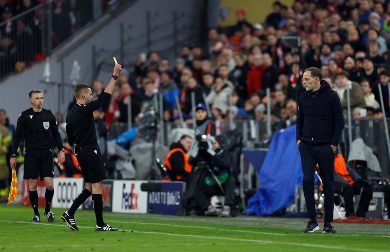 Bayern Munich manager Thomas Tuchel is shown a yellow card by referee Clement Turpin. Reuters