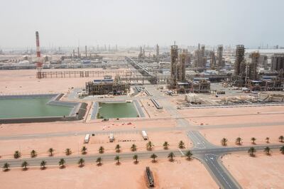 Cracking towers stand beside access roads at the Ruwais refinery and petrochemical complex, operated by Abu Dhabi National Oil Co. (ADNOC), in Al Ruwais, United Arab Emirates, on Monday, May 14, 2018. Adnoc is seeking to create world’s largest integrated refinery and petrochemical complex at Ruwais. Photographer: Christophe Viseux/Bloomberg