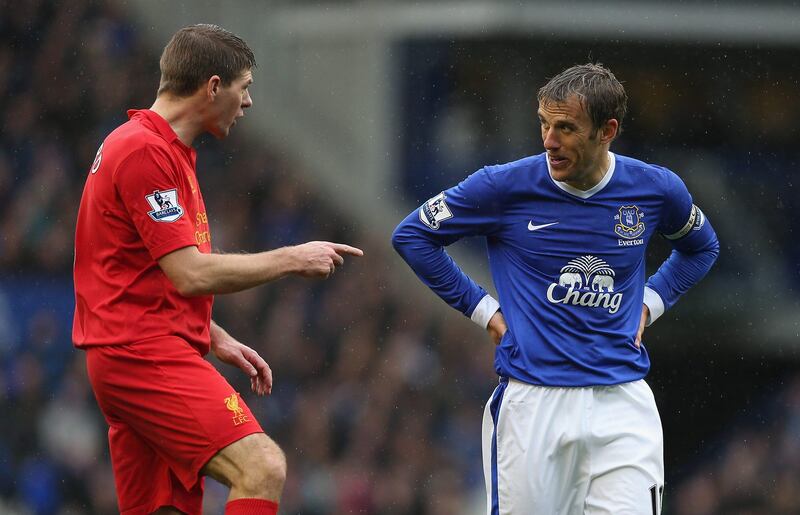 LIVERPOOL, ENGLAND - OCTOBER 28:  Steven Gerrard of Liverpool has words with Phil Neville of Everton during the Barclays Premier League match between Everton and Liverpool at Goodison Park on October 28, 2012 in Liverpool, England.  (Photo by Clive Brunskill/Getty Images) *** Local Caption ***  154873768.jpg