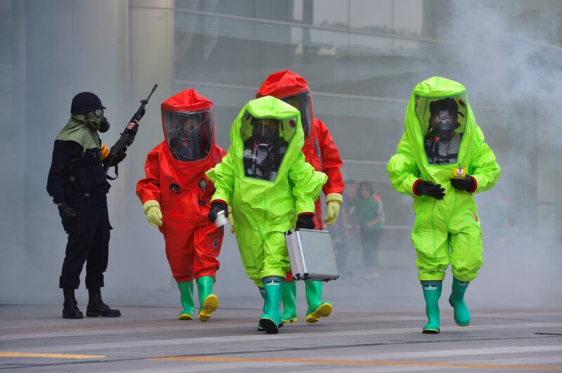 South Korean rescue workers wearing chemical protective suits participate in an anti-terror drill in Seoul. AFP