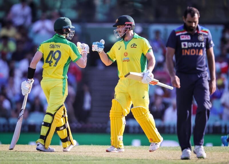 Australia's captain Aaron Finch, centre, and Steve Smith scored centuries against India in Sydney. AFP