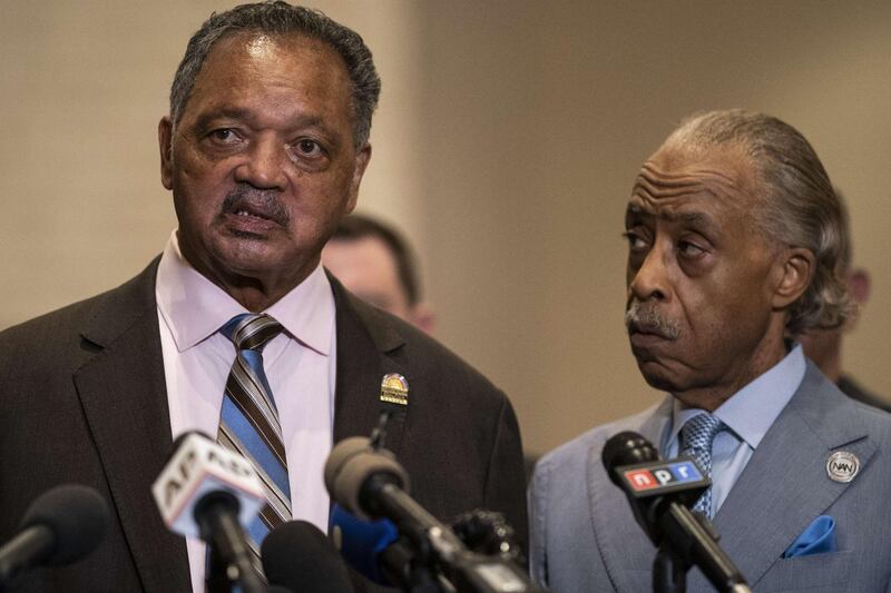 The Rev. Jessie Jackson speaks at a news conference as the Rev. Al Sharpton looks on following the verdict in the Derek Chauvin trial in Minneapolis. AFP
