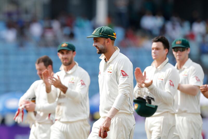 Teammates congratulate Australia's Nathan Lyon, center, after he took six Bangladeshi wickets during the third day of their first test cricket match in Dhaka, Bangladesh, Tuesday, Aug. 29, 2017. (AP Photo/A.M. Ahad)