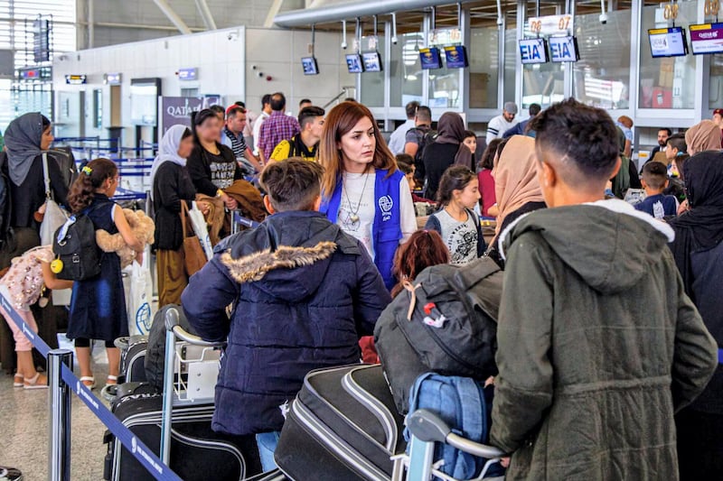 Iraqi Yazidis in the airport of Erbil, Iraq, waiting to board a flight to Toulouse, France. Courtesy IOM Iraq