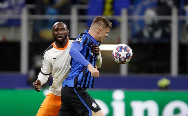 Valencia's Eliaquim Mangala, left, was one of five players and staff at the club to test positive. "I'm feeling good and I have no symptoms associated with the virus. However, I am confined in house and separated from my family," he said on Twitter. AP Photo