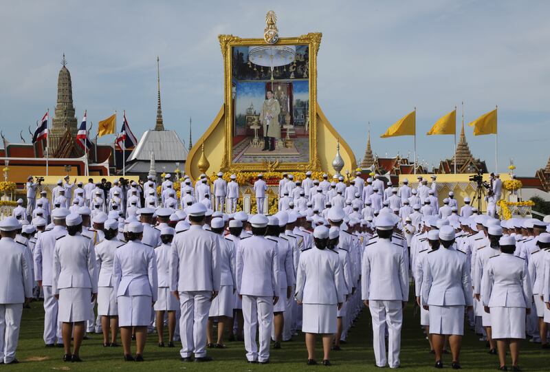 Thai caretaker Prime Minister Prayut Chan-o-cha leads the salute to the portrait of Thai King Maha Vajiralongkorn Bodindradebayavarangkun on the monarch's birthday, in Bangkok. EPA 
