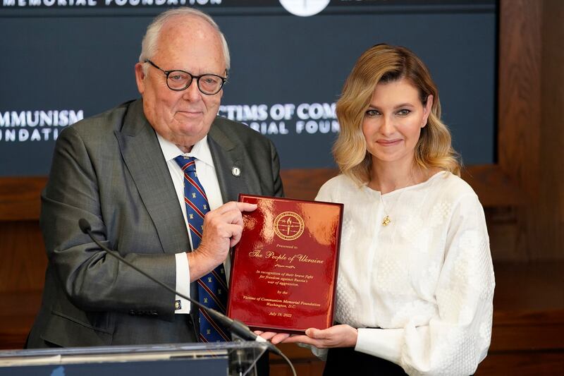 Olena Zelenska, spouse of Ukrainian's President Volodymyr Zelenskyy, accepts the Dissident Human Rights Award on behalf of the people of Ukraine for their fight against Russia from Dr.  Edwin Feulner chairman of the Victims of Communism Memorial Foundation, at the Victims of Communism Museum in Washington. AP