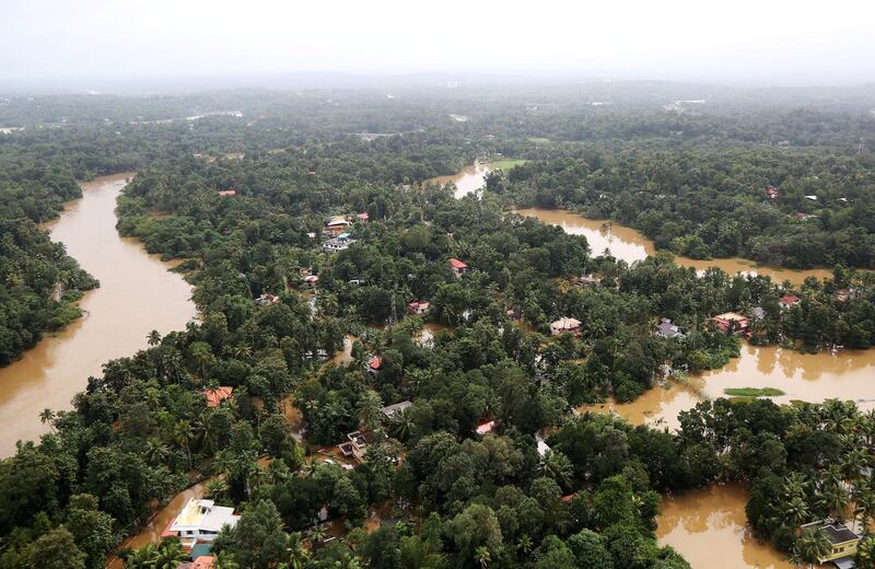 An aerial view shows partially submerged houses at a flooded area in Kerala. Reuters