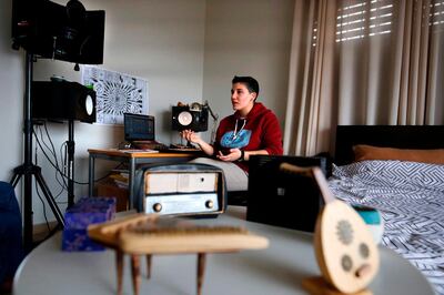 Sarouna, a Palestinian DJ, works on a music track at her home in the West Bank city of Ramallah, in the Israeli-occupied West Bank, on February 7, 2019.  "Electrosteen" is a collaborative work between artists from the Palestinian territories, Israel, Britain, France and Jordan. Each with their own musical backgrounds, the artists worked from hundreds of pieces of traditional Palestinian music recorded about 15 years ago by the Popular Art Centre. / AFP / ABBAS MOMANI
