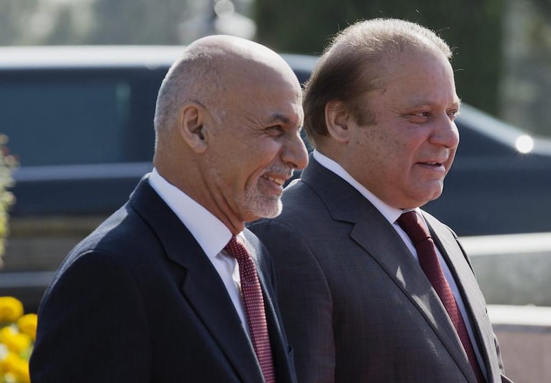 Pakistan's Prime Minister Nawaz Sharif, right, proceeds with visiting Afghan President Asharf Ghani to review a guard of honor at the prime minister house in Islamabad, Pakistan, Saturday, Nov. 15, 2014. Sharif has pledged his support to the Afghan President in his attempt to bring the Taliban to the negotiating table. (AP Photo/B.K. Bangash)