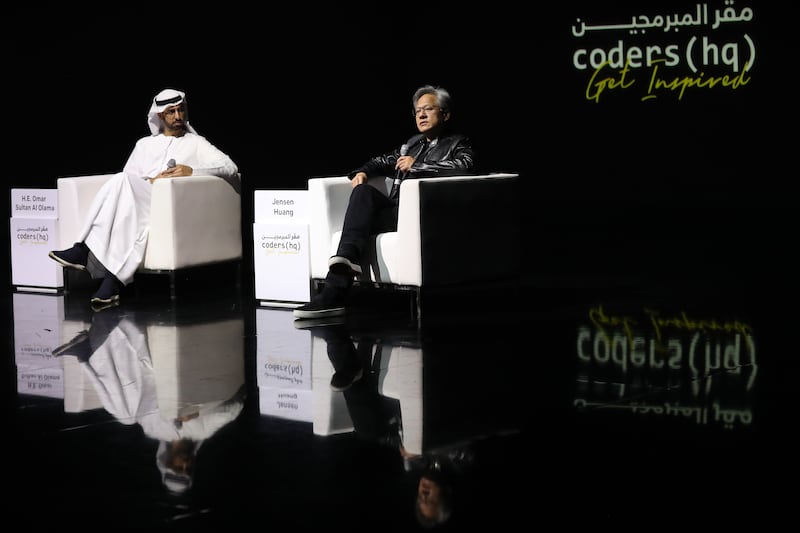 Omar Al Olama, UAE Minister of State for Artificial Intelligence, the Digital Economy and Remote Work Applications, and Jensen Huang, co-founder of Nvidia, during a discussion at the World Governments Summit in Dubai. Chris Whiteoak / The National