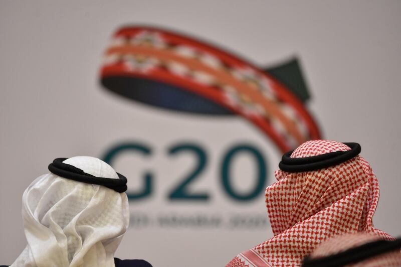 Unidentified guests attend a meeting of Finance ministers and central bank governors of the G20 nations in the Saudi capital Riyadh on February 23, 2020. - The deadly coronavirus epidemic will dent global growth, the IMF warned, as G20 finance ministers and central bank governors weighed its economic ripple effects at a two-day gathering in Riyadh. (Photo by FAYEZ NURELDINE / AFP)