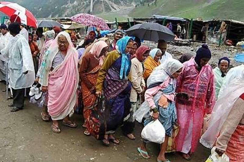 A group of female pilgrims starts a journey to the  Amarnath cave-temple 3,900 metres up from the Baltal base camp.