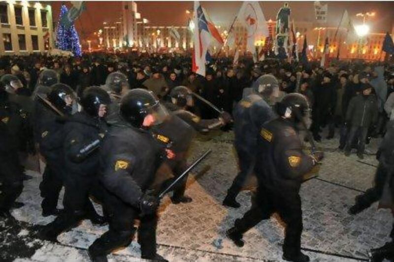 Protesters clash with riot police during an opposition rally in Minsk in December last year. Viktor Drachev / AFP