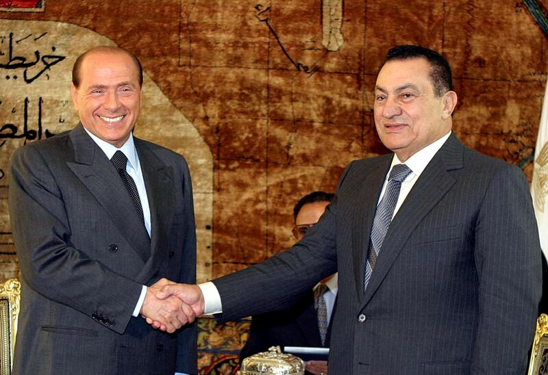Egyptian President Hosni Mubarak shakes hands with Mr Berlusconi in Cairo in June 2003. Mr Berlusconi urged Israel to show 'greater wisdom' after its failed attempt to assassinate a radical Palestinian leader. AFP